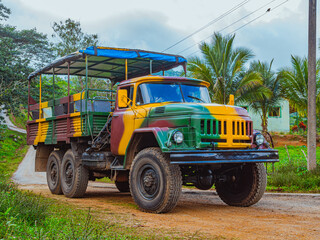 Obraz premium Guanayara National Park, Trinidad, Cuba. Soviet truck adapted for tourist trips through the mountains of Cuba in Guanayara Park. Military camouflage ZIL truck. Tourist routes in Guanayara Park