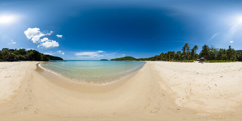 Clear sea waves crashing over sandy beach in Duli Beach. Blue sky and clouds. El Nido. Palawan. Philippines. VR 360.