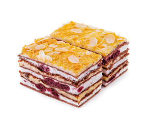 two slices of multilayer cocoa sponge cake with almonds