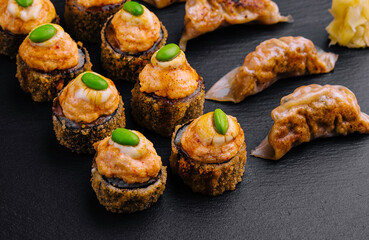Gyoza or dumplings snack and warm sushi top view