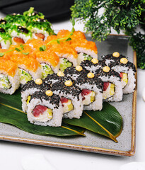 three different types of sushi rolls