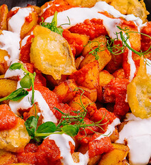 freshly cooked prawns in spicy tomato sauce and fish in batter