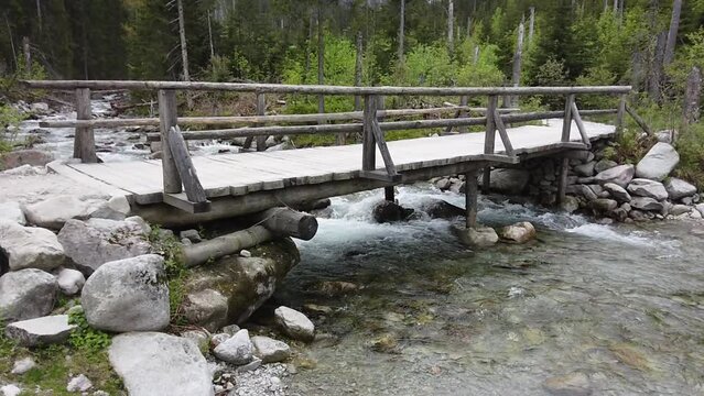 wooden bridge and hiking path to the Morskie Oko lake in Poland