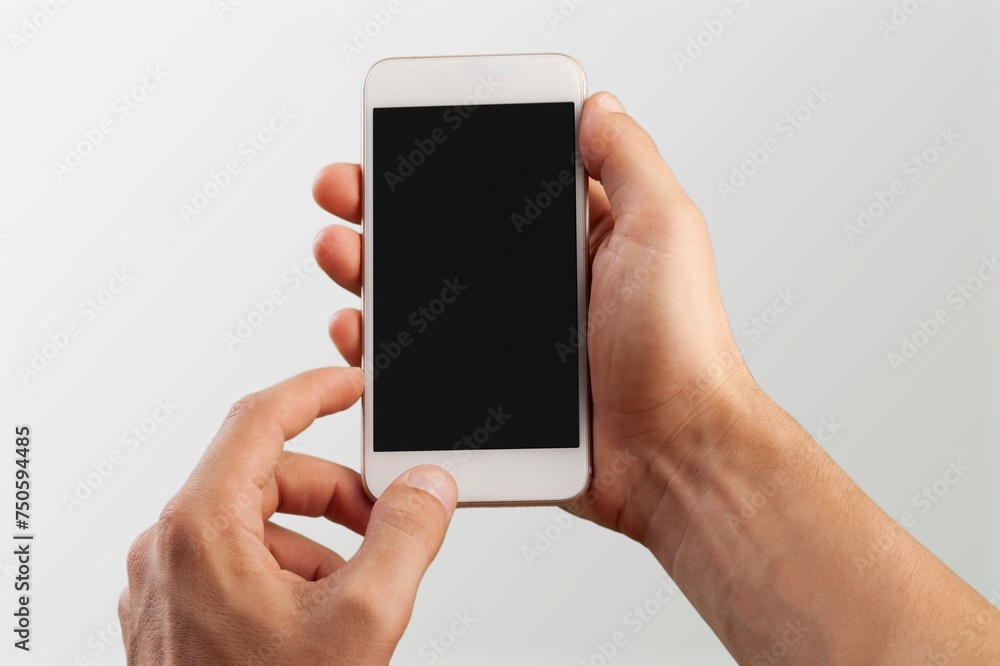 Poster Hand holding modern smartphone with a blank screen