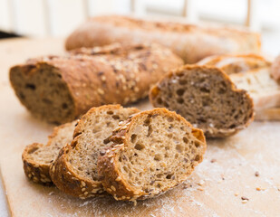 Fresh loaf of bread on wooden board