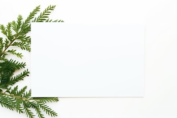 Fototapeta premium Vibrant green leaves of various textures encircle a clean white sheet, providing a nature-inspired background