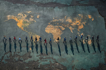 Top view of group of people casting long shadows over a map of the world, symbolizing unity and diversity Generative AI