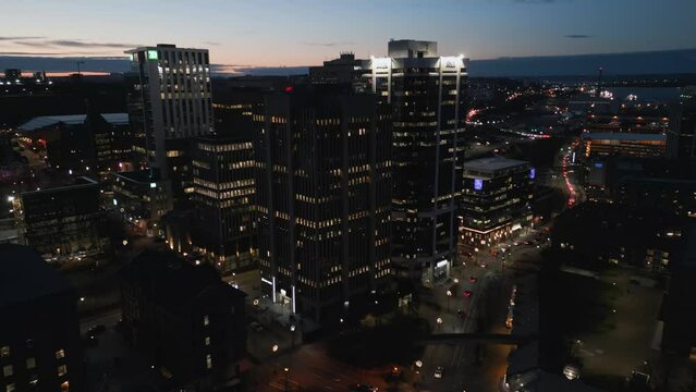 Aerial view of Halifax at night with skyscrapers at sunset at dusk. Nova Scotia, Canada. Drone shot of Halifax downtown at twilight from high above.