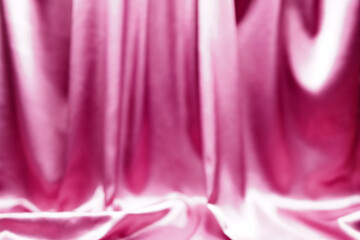 Purple satin or silk, shiny, beautiful and luxurious. It is an abstract background with a beautiful...
