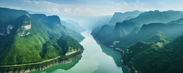 Bird's eye view of a majestic river flowing between amazing green mountains.