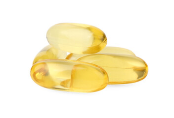 Many yellow vitamin capsules isolated on white