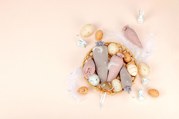 Handmade Easter concept. Sewn textile carrots with traditional decoration. Festive symbols