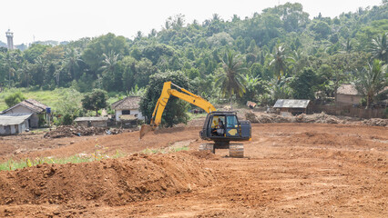 someone is operating heavy equipment in the field