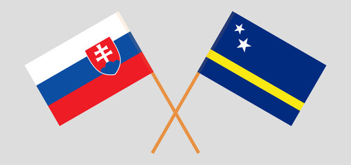 Crossed flags of Slovakia and Country of Curacao. Official colors. Correct proportion