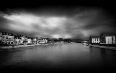 A view of the Aisne River in flood in Soissons, France, in black and white.