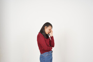 Young Asian woman in Red t-shirt Suffering Headache gesture  isolated on white background