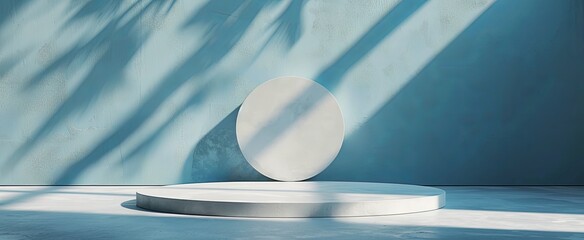Modern minimalist abstract background featuring a circular podium and geometric shapes, with a play of light and shadow on a textured blue wall.