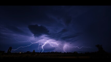 Naklejka premium Lightning Strike in the dark sky over the city. Lightning storm over city in purple light