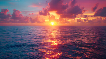 A photo featuring the majestic beauty of the sun rising over the vast expanse of the ocean, painting the sky with vibrant hues of orange and pink. Highlighting the awe-inspiring spectacle of the sunri