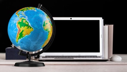 Travel composition concept, globe and laptop