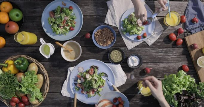 Table with a variety of vegetables in a plate, set for a delicious and healthy meal in a restaurant with salad, dinner, and buffet options, perfect for a wedding banquet or party celebration