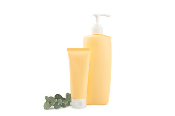 Bottle of shampoo and hair mask with eucalyptus extract isolated on a white background. Towel and hair comb. Natural cosmetic product. Hair and scalp care. Beauty concept.