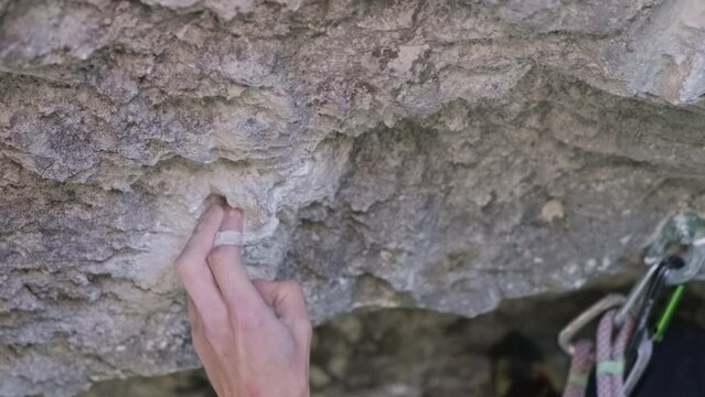 Person Climbing Up Side of Mountain
