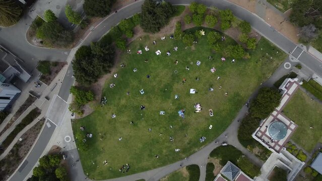 Aerial video of people having a picnic on the UC Berkeley campus. in the United States.