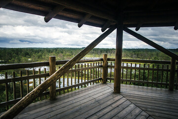 Lahemaa National Park view point. Wooden tower over swamp. Nature observatory. Nature landscape of Estonia. Aerial view of wetland.