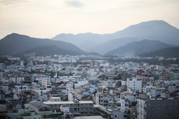 Aerial view of cityscape with mountains in the distance