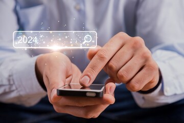 Trends 2024. Businessman search on smartphone