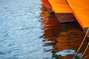 Reflection of the prows of fishing boats in the port of Mar del Plata, Argentina
