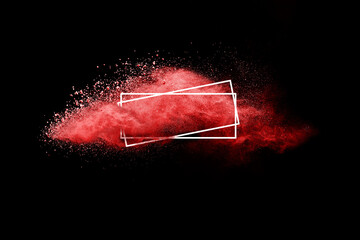 Freeze motion of red color powder exploding on black background.