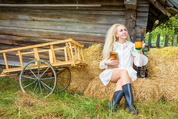 Beautiful blonde girl in the hayloft