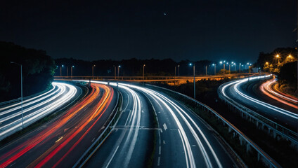 Fototapeta na wymiar High-speed traffic on a night road, long exposure shot with streaks of light. 