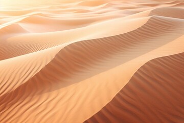 Fototapeta na wymiar Sand patterns formed by wind on a desert dune during golden hour