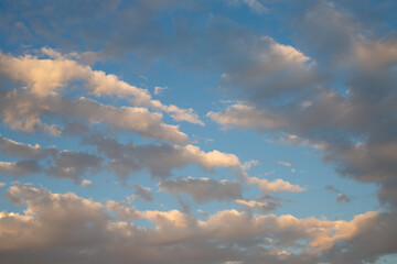 Fototapeta na wymiar Beautiful sunset sky background with clouds. Scenic cloudscape.