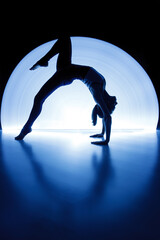 A female gymnast on gymnastic canvases