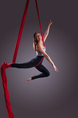 A female gymnast on gymnastic canvases