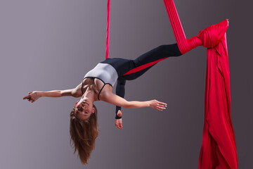 A female gymnast on gymnastic canvases