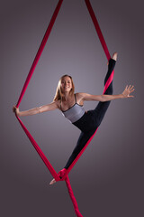 A female gymnast on gymnastic canvases