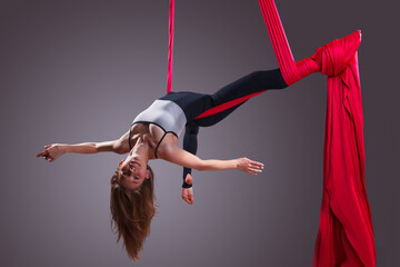 A female gymnast on gymnastic canvases