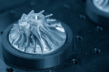 The turbine parts form metal 3D printing process in the light.
