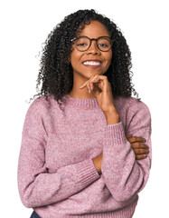 African American woman in studio setting smiling happy and confident, touching chin with hand. - obrazy, fototapety, plakaty