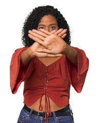 African American woman in studio setting doing a denial gesture