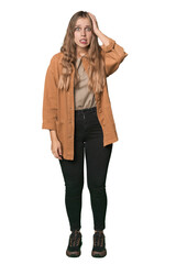 Studio portrait of a blonde Caucasian woman being shocked, she has remembered important meeting.