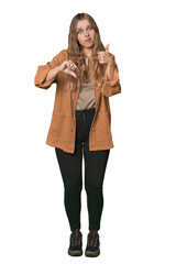 Studio portrait of a blonde Caucasian woman showing thumbs up and thumbs down, difficult choose concept