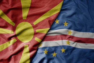 Fototapeta premium big waving national colorful flag of cape verde and national flag of macedonia .