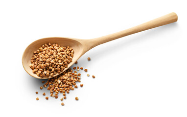 Wooden spoon with dry buckwheat