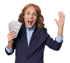 Mid-aged Caucasian with dollars in studio receiving a pleasant surprise, excited and raising hands.